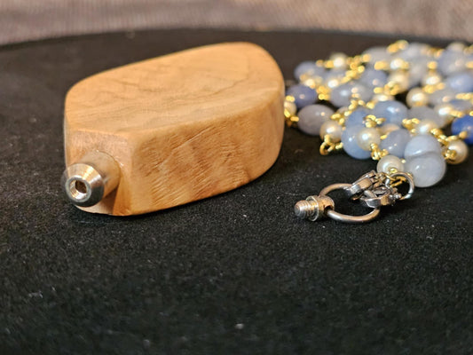 COD:TGP0002 – Collana lunga porta-essenze in legno di ulivo, agate e acciaio/ottone